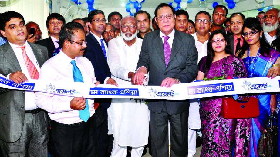 A Rouf Chowdhury, Chairman of Bank Asia Limited, inaugurating an agent banking booth at Sholla Bazar, Nababgonj in Dhaka on Sunday.