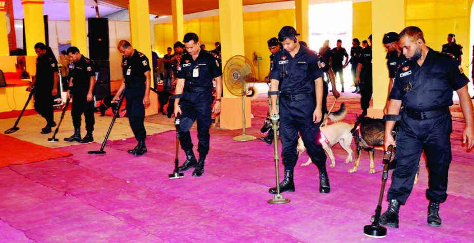 Law enforcers scanning the city's Banani Puja Mandop premises with metal detectors on Tuesday as part of security measures during Durga Puja, the biggest religious festival of the Hindu Community.