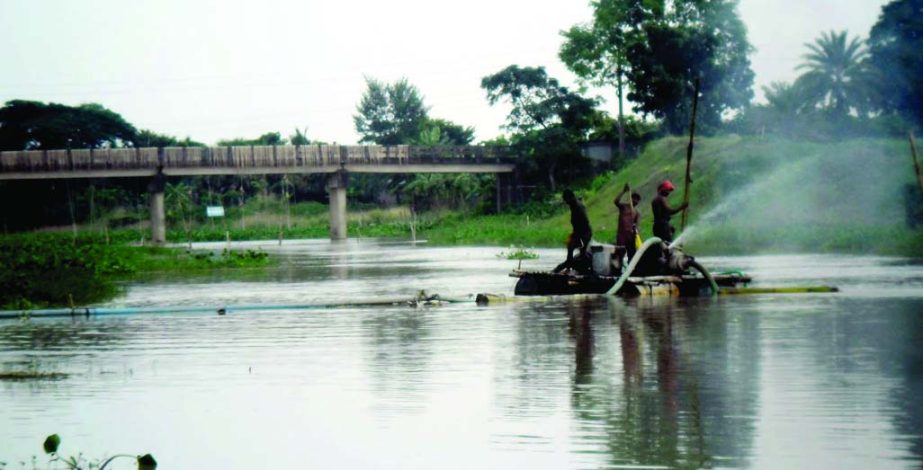 FARIDPUR: Illegal sand lifting from Bhubonneshor River at Faridpur Sadarpur Upazila has threatened main culvert on Sadarpur- Charbhadra Road. This picture was taken on Tuesday.