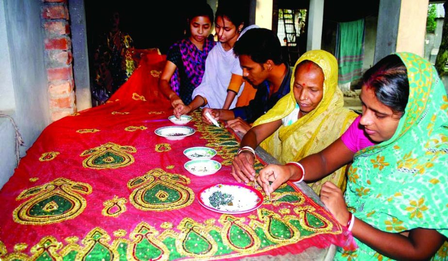 BOGRA: Craft artists are busy in designing on shariees at Dhunot Upazila.