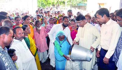 DINAJPUR: Iqbalur Rahim MP, Dinajpur distributing rice among poor people ahead of Eid- ul- Azha at Dinajpur Sadar Upazila yesterday.