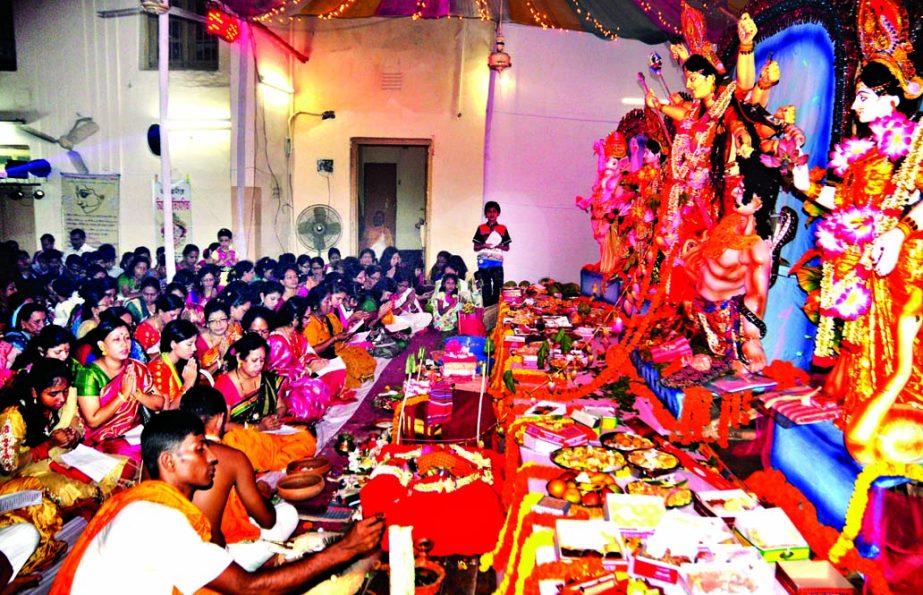 Hundreds of devotees offered Anjali before the Goddess Durga at Azimpur Puja Mandap.