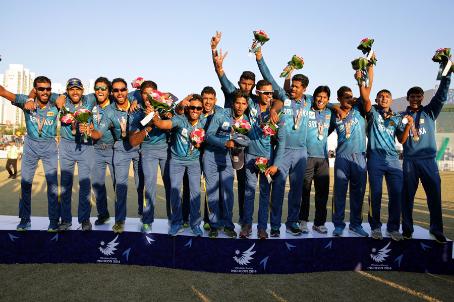 The Sri Lankan players celebrate after securing the gold medal in the Asian Games beating Afghanistan in Asian Games Cricket final at Incheon on Friday.