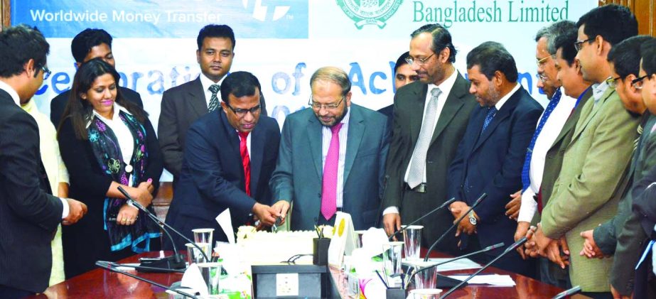 Mohammad Abdul Mannan, Managing Director of Islami Bank Bangladesh Limited and Md Khairuzzaman, Head of Transfast Remittence LLC, celebrating 30 thousand transactions in a month through Transfast for inward remittance by cutting cake recently.