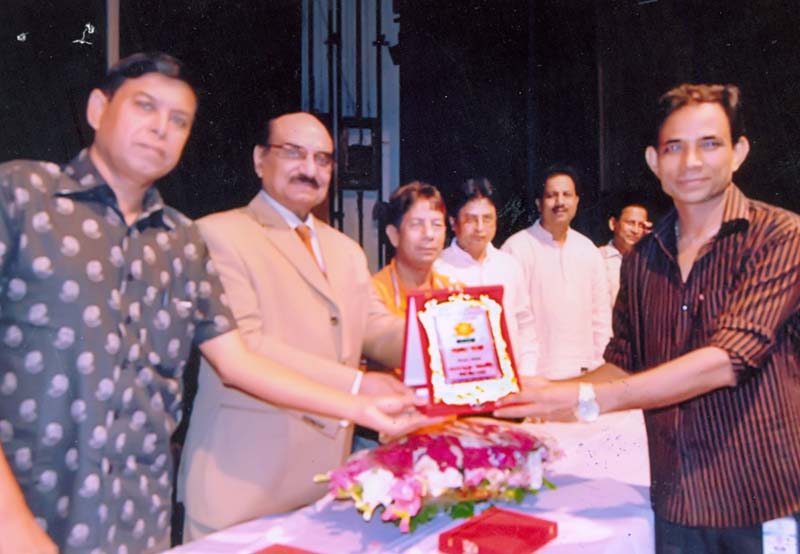 Monsoor Ali receiving award from Member of Advisory Committee of Bangladesh Awami League Yousuf Hossain Humayun at the Auditorium of Shilpakala Academy in the city recently. Monsoor Ali was awarded for his special contribution in Bangladesh's sports.