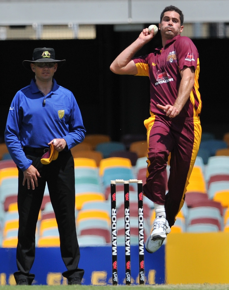 Ben Cutting sends down a delivery during the match of Matador BBQs Cup between Queensland and Victoria at Brisbane on Saturday.