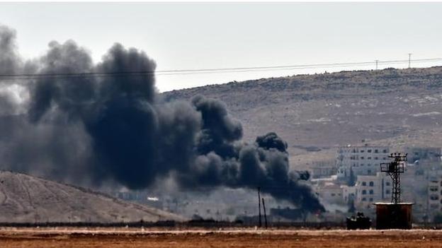 Civilians flee the Syria-Turkey border town of Kobane, as Islamic State militants enter and engage in street-to-street fighting with Syrian Kurds.