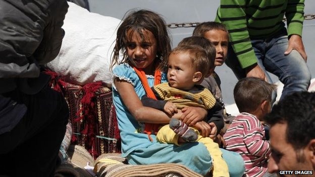 Civilians continue to flee Kobane across the Turkish border