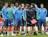 Coach Joachim Loew (right) stands next to his assistant Thomas Schneider as he talks to his players during a training session of Germany's national soccer team in Frankfurt, Germany on Wednesday. Germany will play against Poland in a group D qualifying m
