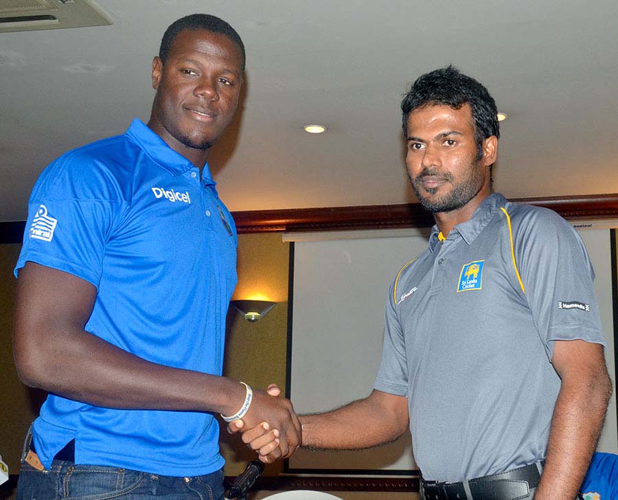 Carlos Brathwaite and Upul Tharanga shake hands at the start of the West Indies A tour of Sri Lanka at Colombo on Wednesday.