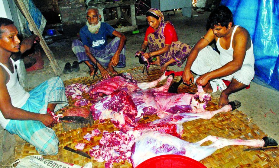 A sacrificial animal being slaughtered on the occasion of Eid-ul-Azha. The snap was taken from the city's Wari area on Monday.