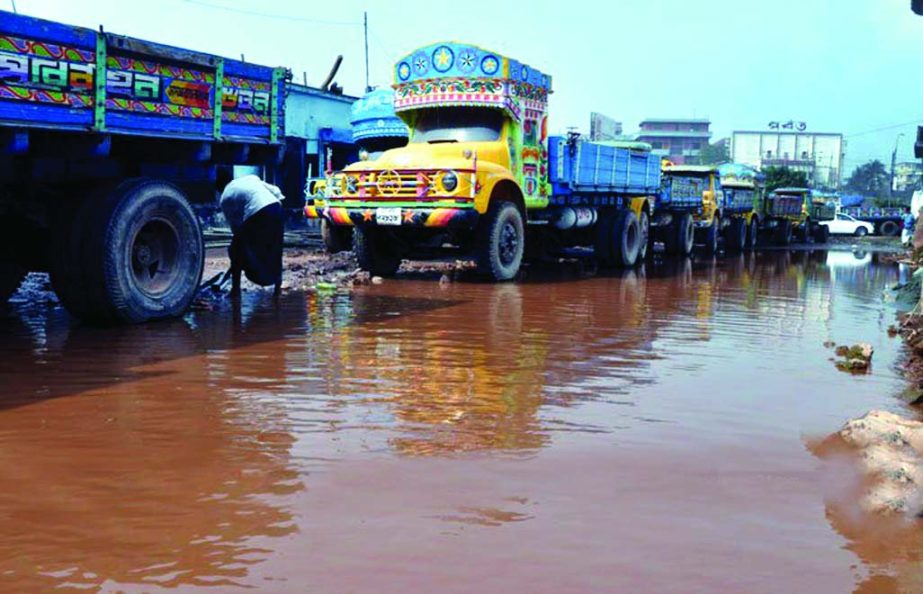 Road adjacent to the city's Gabtali Hat submerged in rainwater on Thursday due to poor drainage system but the authorities are indifferent to mitigate the woes of the pedestrians by reforming it.