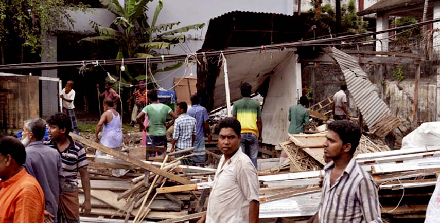 Illegal establishments in front of Narayanganj Government College being evicted on Thursday.
