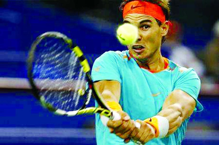 Rafael Nadal of Spain returns a shot during his men's singles tennis match against Feliciano Lopez of Spain at the Shanghai Masters tennis tournament in Shanghai on Wednesday.