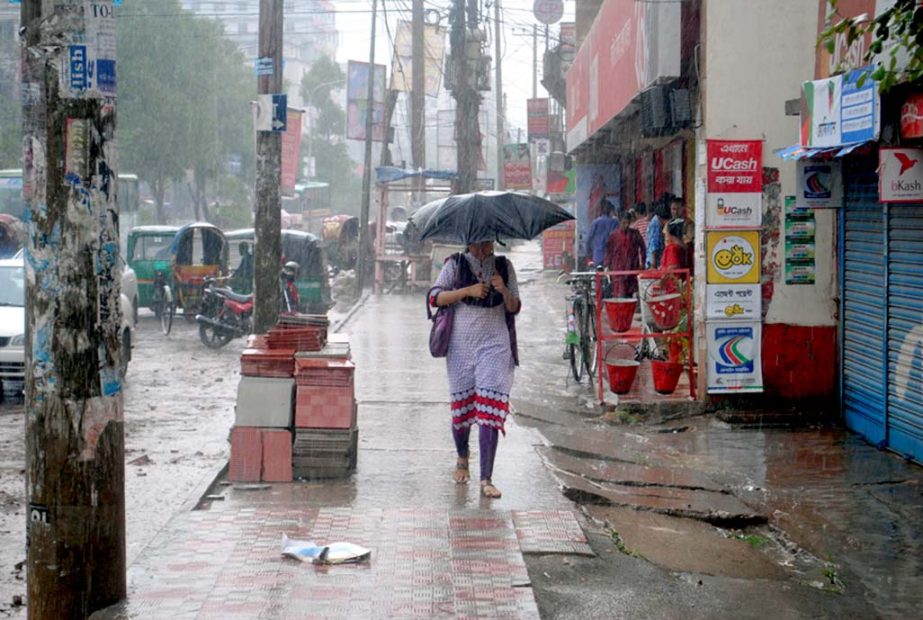 City dwellers get relief from scorching heat due to brief drizzle. The snap was taken from the city's Shahbagh area on Friday.