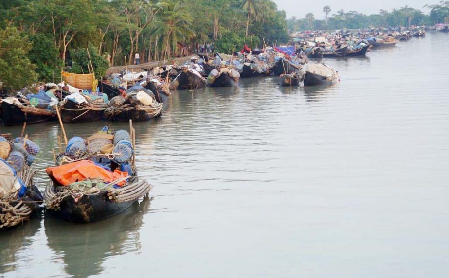 Fishermen taking preparations for going to sea braving storm and pirates. The snap was taken from Mongla on Friday.