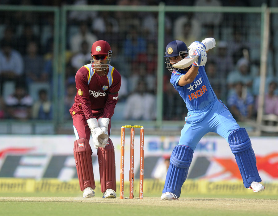 Ajinkya Rahane drives through the covers during the 2nd ODI between India and West Indies at Delhi on Saturday. India scored 263 for the loss of seven wickets in 50 overs.
