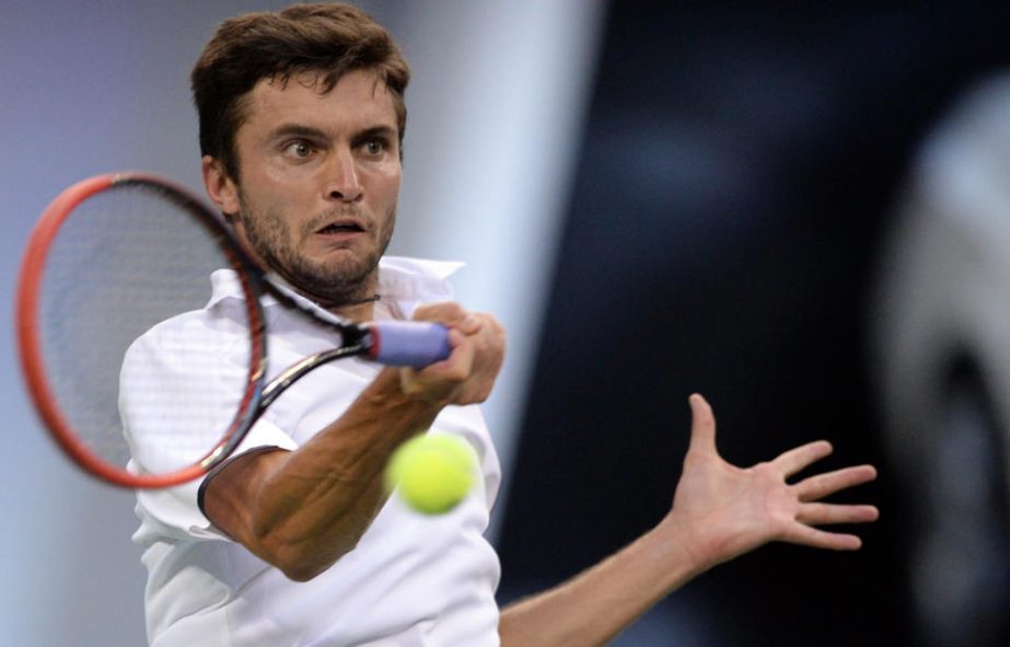 Gilles Simon of France hits a return against Feliciano Lopez of Spain during their men's singles semi-final match of the Shanghai Masters tennis tournament held at the Qizhong Tennis Stadium in Shanghai on Saturday.