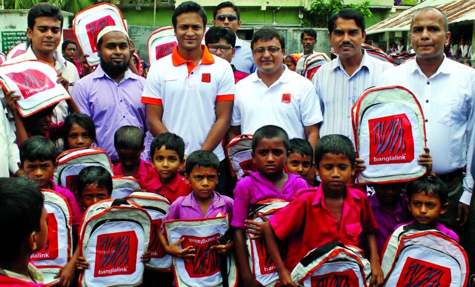 Shakib Al Hasan, Banglalink Brand Ambassador, distributing recycled school bags among the three districts primary school children recently. High ups of the company were present.