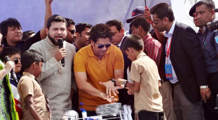 Sachin Tendulkar spends some time with the students of Noapara Government Primary School of Rupganj during his Rupganj visit on Tuesday.