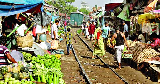 Makeshift shops on both sides of Railway lines in city started growing fast despite eviction by the authorities. This photo was taken from Jurain area on Tuesday.