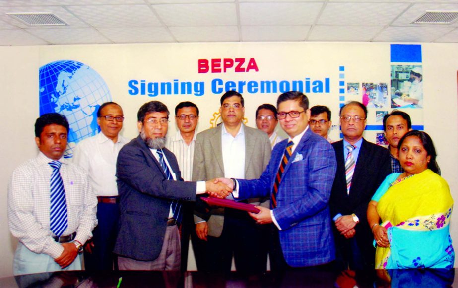 Sayed Nurul Islam, Member (Investment Promotion) of BEPZA and Miran Ali, Director of Baridhi Garments Limited sign a deal to set up readymade garments industry in Comilla Export Processing Zone recently.