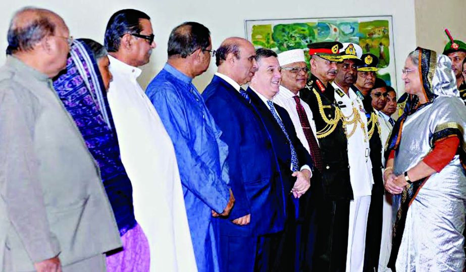 Prime Minister Sheikh Hasina exchanging pleasantries with cabinet members, diplomats and chiefs of three services at Hazrat Shahjalal International Airport on Wednesday on the eve of her departure to Italy. BSS photo