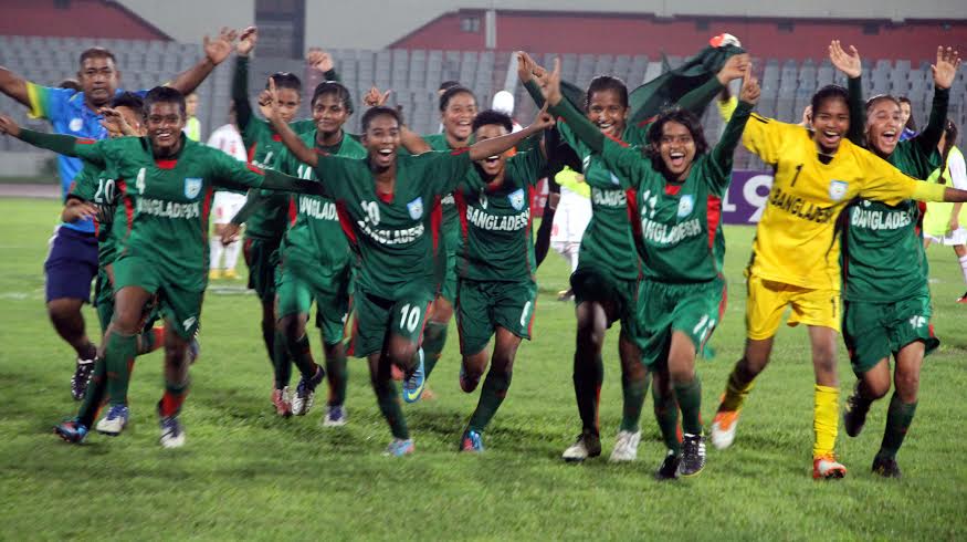 Members of Bangladesh Under-16 National Women's Football team celebrate after beating Jordan Under-16 National Women's Football team in their opening match of the AFC Under-16 Women's Championship Qualifiers at the Bangabandhu National Stadium on Wedne