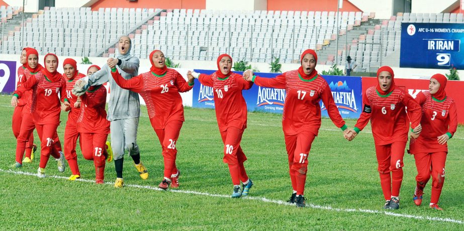 Players of Iran Under-16 National Women's Football team celebrate after defeating United Arab Emirates Under-16 National Women's Football team in their first match of the AFC Under-16 Women's Championship Qualifiers at the Bangabandhu National Stadium