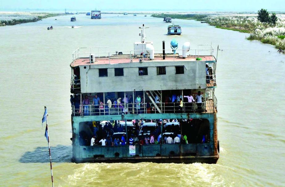 Ferries from Mawa to Kawrakandi Ghat plying through a short-cut route in the char areas ignoring the danger mark. This photo was taken on Wednesday.