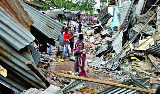 Eviction of illegal structures being continued by Railway authorities. This photo was taken from Uttara area on Wednesday.