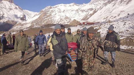 Nepalese soldiers have been bringing back those rescued from the avalanches