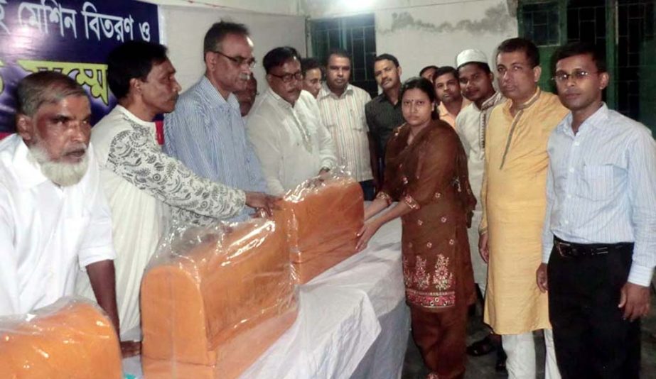 Md Muslim Chowdhury , Additional Secretary, Ministry of Finance distributing sewing machine at a reunion meeting of Kadalpur High School at chittagong yesterday.