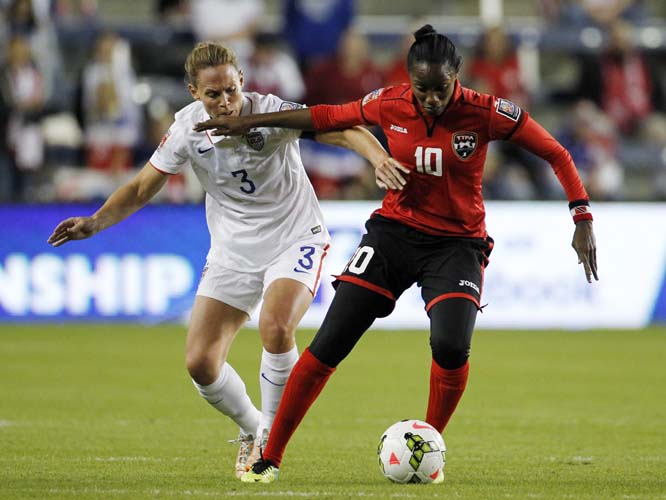 United States' Christie Rampone (3) pressures Trinidad and Tobago's Tasha St. Louis (10) during the first half of a CONCACAF Women's Championship soccer game on Wednesday in Kansas City, Kan.