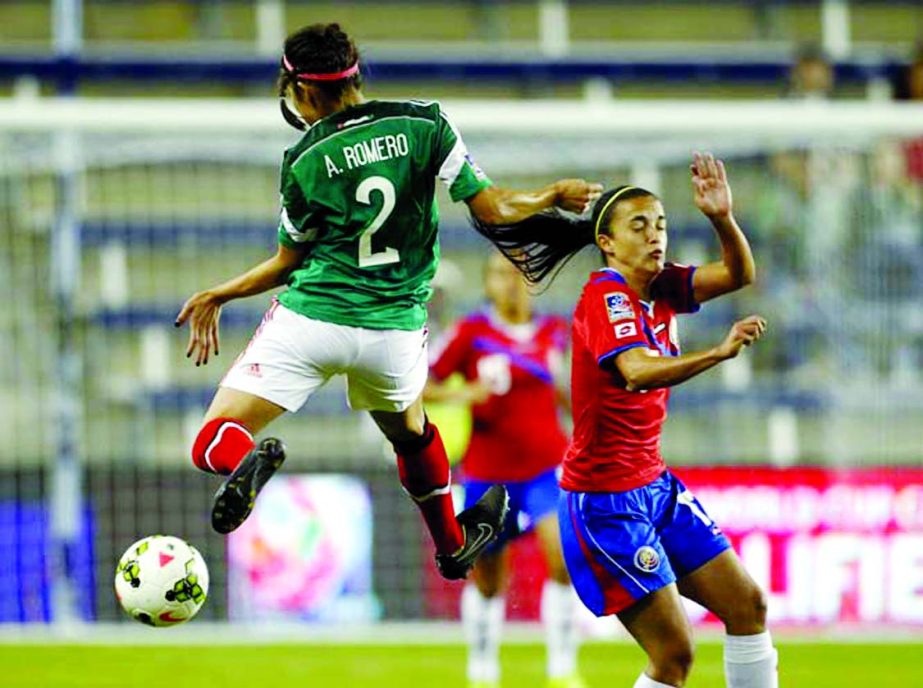 Mexico's Arianna Romero (2) goes up for the ball as Costa Rica's Melissa Herrera (17) defends during the first half of a CONCACAF Women's Championship soccer match in Kansas City, Kan on Thursday.