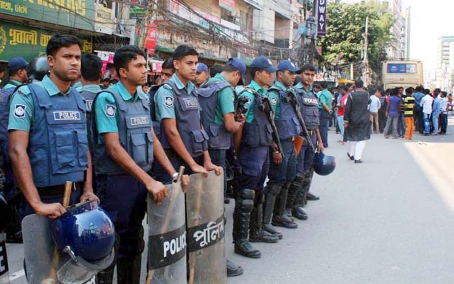 Law enforcers remain alert in front of the BNP Central Office in the city's Nayapalton on Friday as part of security measures to avoid any untoward incident among JCD activists.