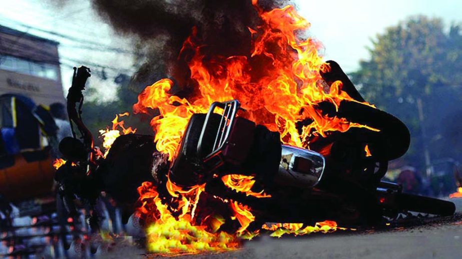 At least 3 motor-bikes were torched when the JCD activists not included in the new committee locked in clashes (not in pix) in Sylhet. This photo was taken from Shaheed Minar premises on Friday.