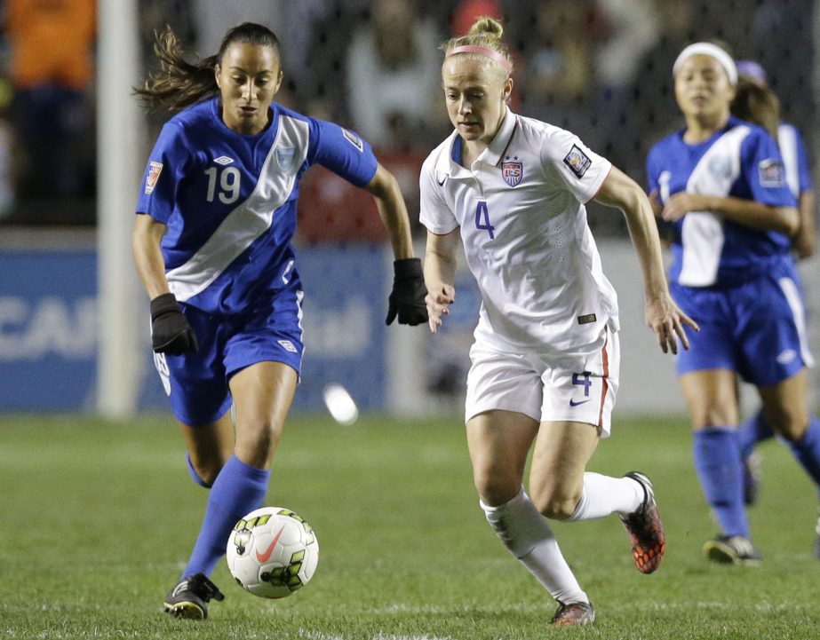 United States' Becky Sauerbrunn (4) and Guatemala's Diana Barrera (19) chase the ball during the second half of a CONCACAF Women's Championship soccer game on Friday in Bridgeview, Ill. The United States won 5-0.
