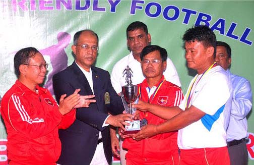 Chief of General Staff of Bangladesh Army Lieutenant General Md Mainul Islam handing over the trophy to Myanmar Army Football team, which beat Bangladesh Army Football team in a friendly football match at the Bangladesh Army Stadium in Dhaka Cantonment on