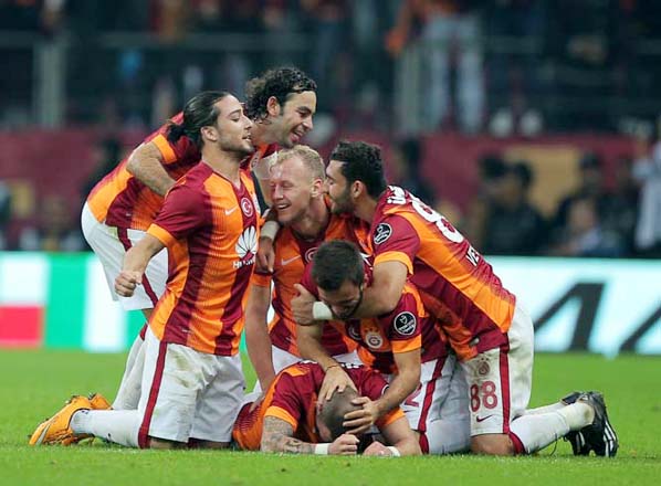 Galatasaray's soccer players celebrate during their Turkish League soccer derby match with Fenerbahce at the TT Arena stadium in Istanbul, Turkey on Saturday.
