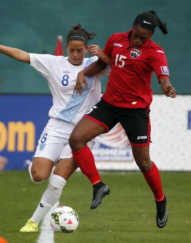 Guatemala forward Maria Monterroso (8) and Trinidad & Tobago defender Liana Hinds (15) go for the ball during the first half of a CONCACAF soccer match at the RFK Stadium in Washington on Monday.