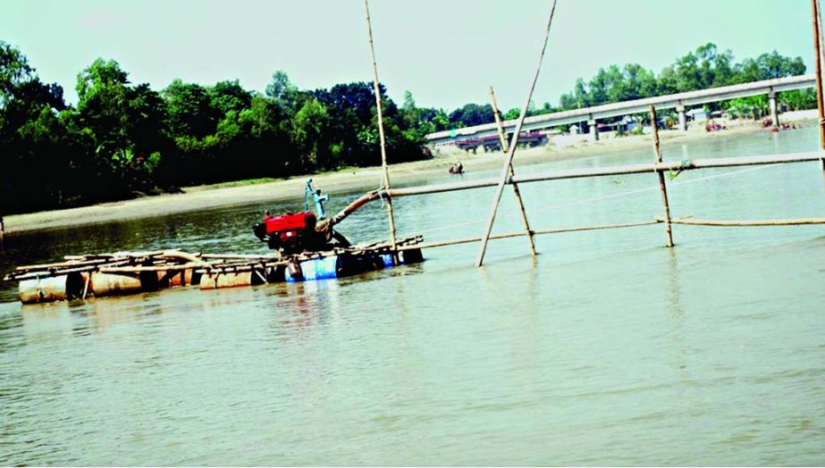 BOGRA: Illegal sand lifting is going on beside Bilchapri canal on Bangail River. No effective measure yet to taken by authority concern. This picture was taken on Tuesday.