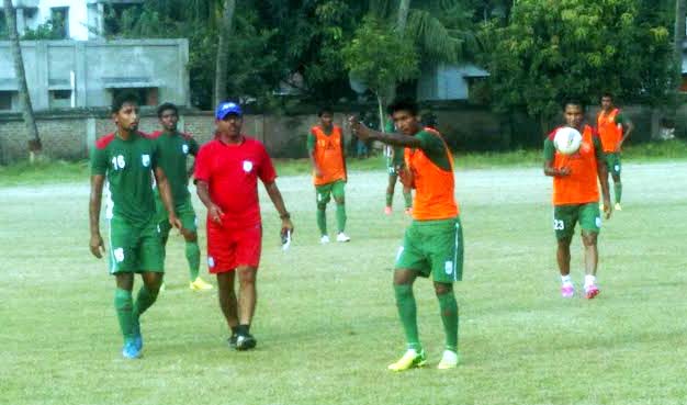 Players of Bangladesh National Football team taking part in their practice session at the Jessore Police Line Ground on Wednesday.