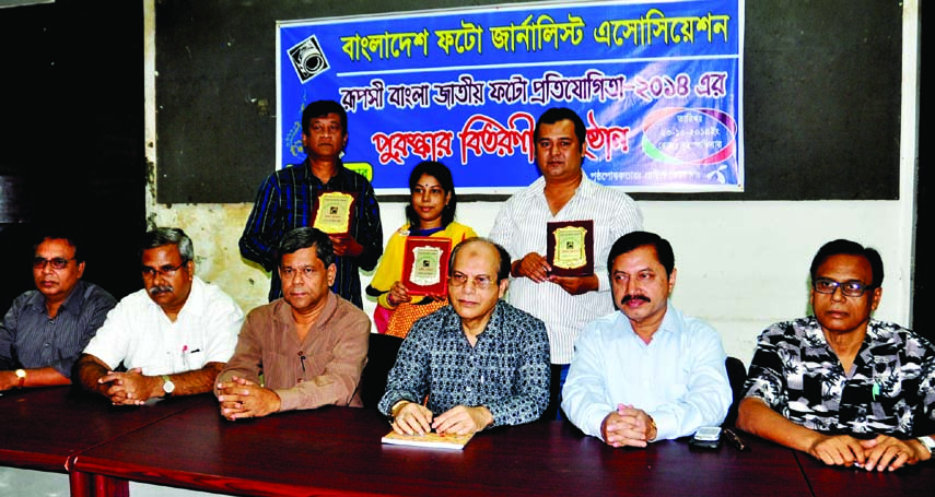 Prime Minister's Media Adviser Iqbal Sobhan Chowdhury, among others, at the prize giving ceremony of Rupashi Bangla National Competition organized by Bangladesh Photojournalist Association at the National Press Club on Thursday.