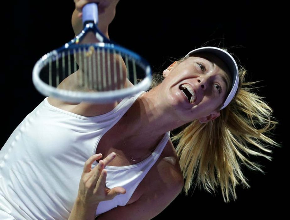 Russia's Maria Sharapova serves to Poland's Agnieszka Radwanska during their singles match at the WTA tennis finals in Singapore on Friday.