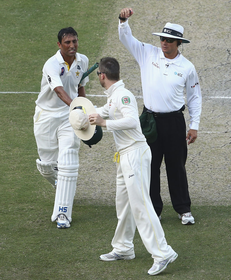 Younis Khan is congratulated by Michael Clarke after recording his second hundred of the Test on the 4th day of 1st Test between Pakistan and Australia in Dubai on Saturday.