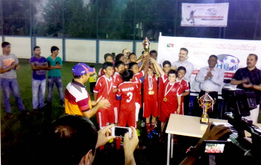 The winners of the International Turkish Hope School (ITHS) Inter-School Football Tournament celebrate with the trophy at the ITHS Main Campus recently.