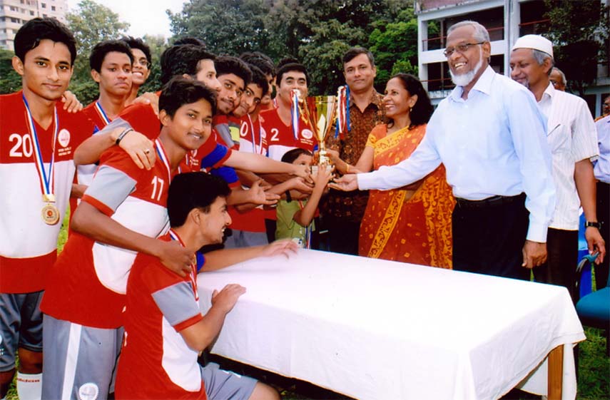 Vice-Chancellor of BUET Professor Khaleda Ekram handing over the championship trophy of the Inter-Faculty VC Cup Football Competition to the team leader of the faculty of Civil Engineering at the University Play Ground on Thursday. Faculty of Civil Engine