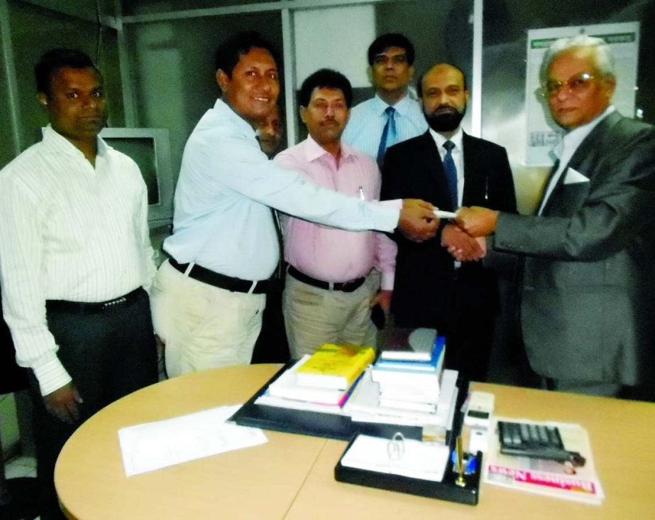 KAM Ferdous, Managing Director of Takaful Islami Insurance Limited, handing over a cheque of Tk 57,34,277.00 as fire insurance claim of Islami Bank Bangladesh Limited, Nababpur Branch in the city recently. Md Faizul Kabir, Executive Vice President of IBBL
