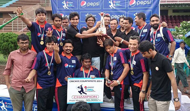 Channel 24, the champions of the Pepsi-DRU Cricket Tournament pose for a photo session at the Moulana Bhashani National Hockey Stadium on Monday.